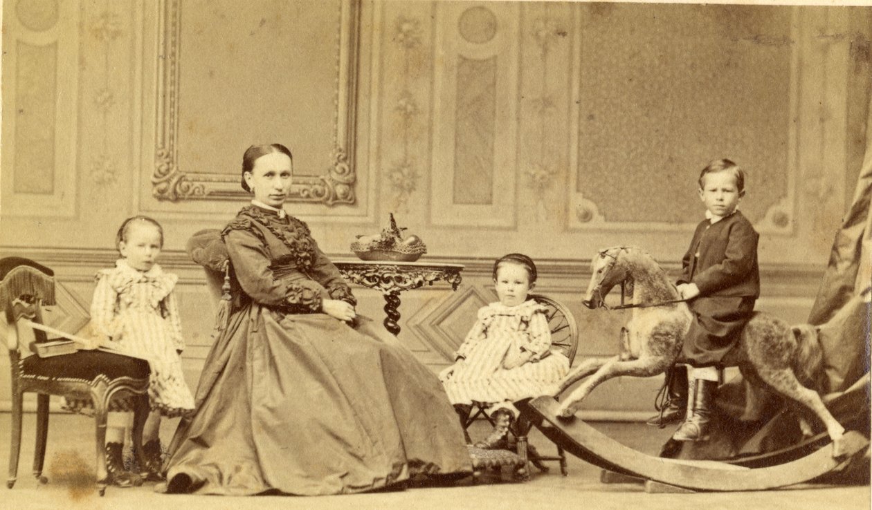रॉकिंग घोड़े पर युवा लड़का अपने परिवार से घिरा हुआ, 1860 (एल्बम प्रिंट) द्वारा जॉर्ज फ्रेडरिक ब्रांडीफ